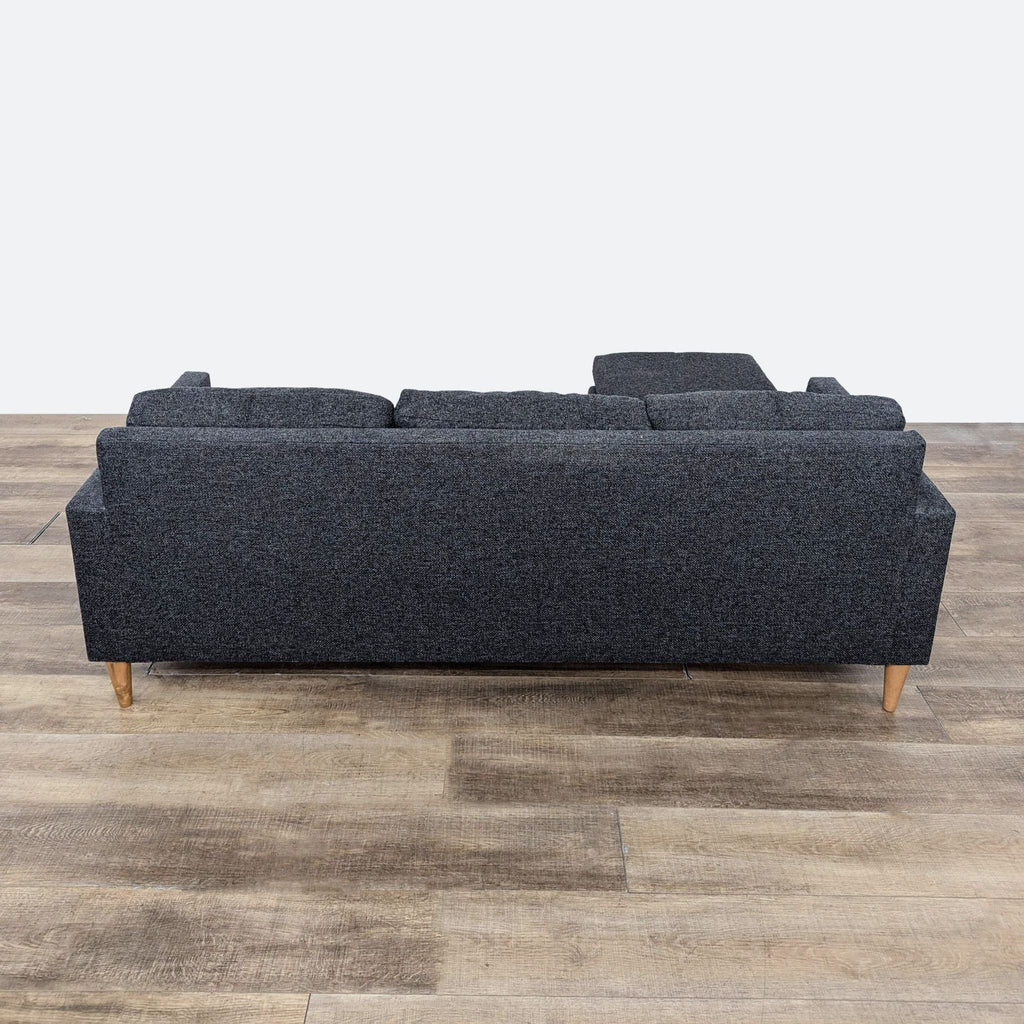 the sofa is a modern design with a modern twist.