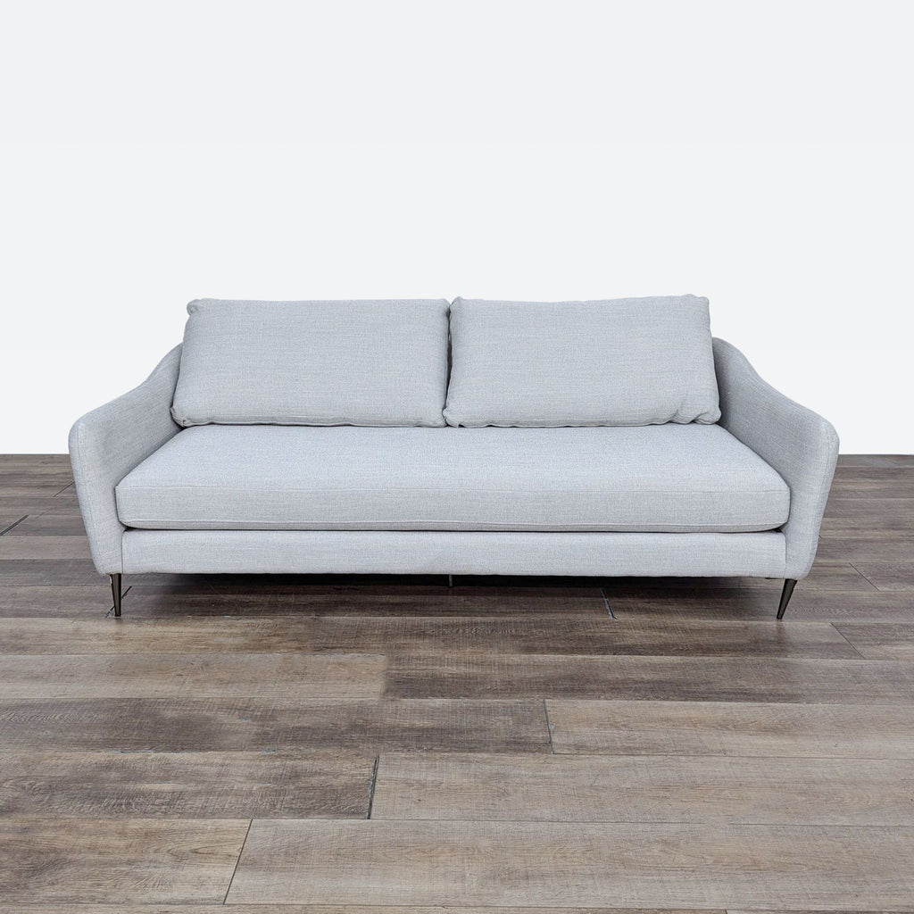 sofa is a modern sofa that is made of soft grey fabric. the sofa is made of soft