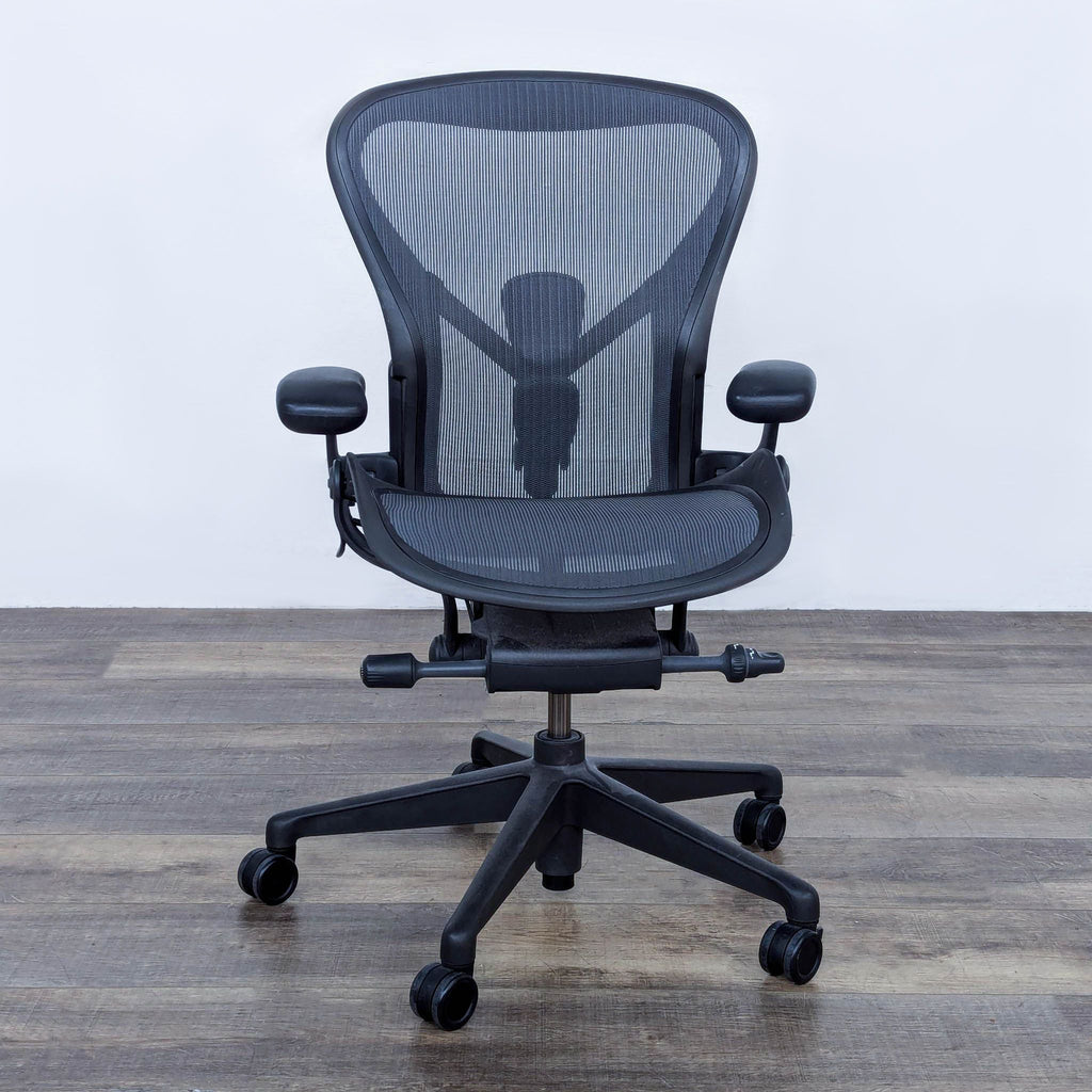 the [ unused0 ] chair has a mesh back and arms.