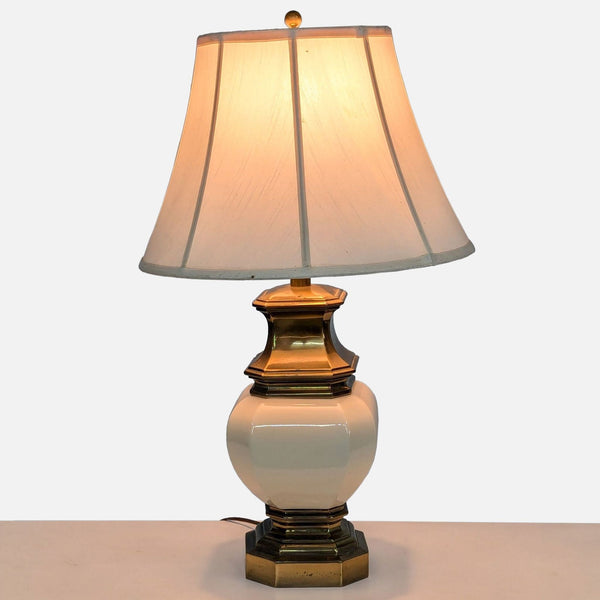 a vintage table lamp with a white porcelain shade.