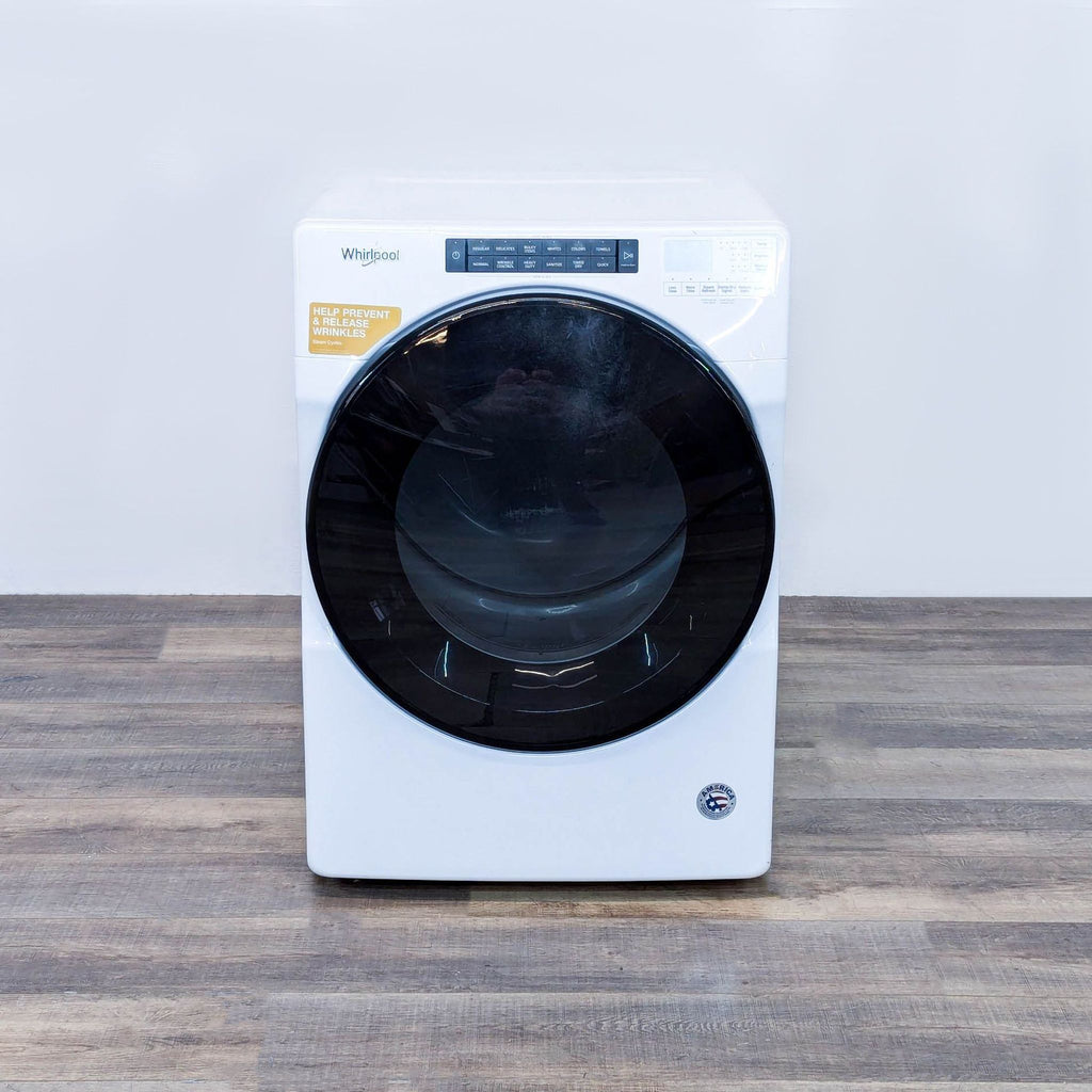 a washing machine on a wooden table.