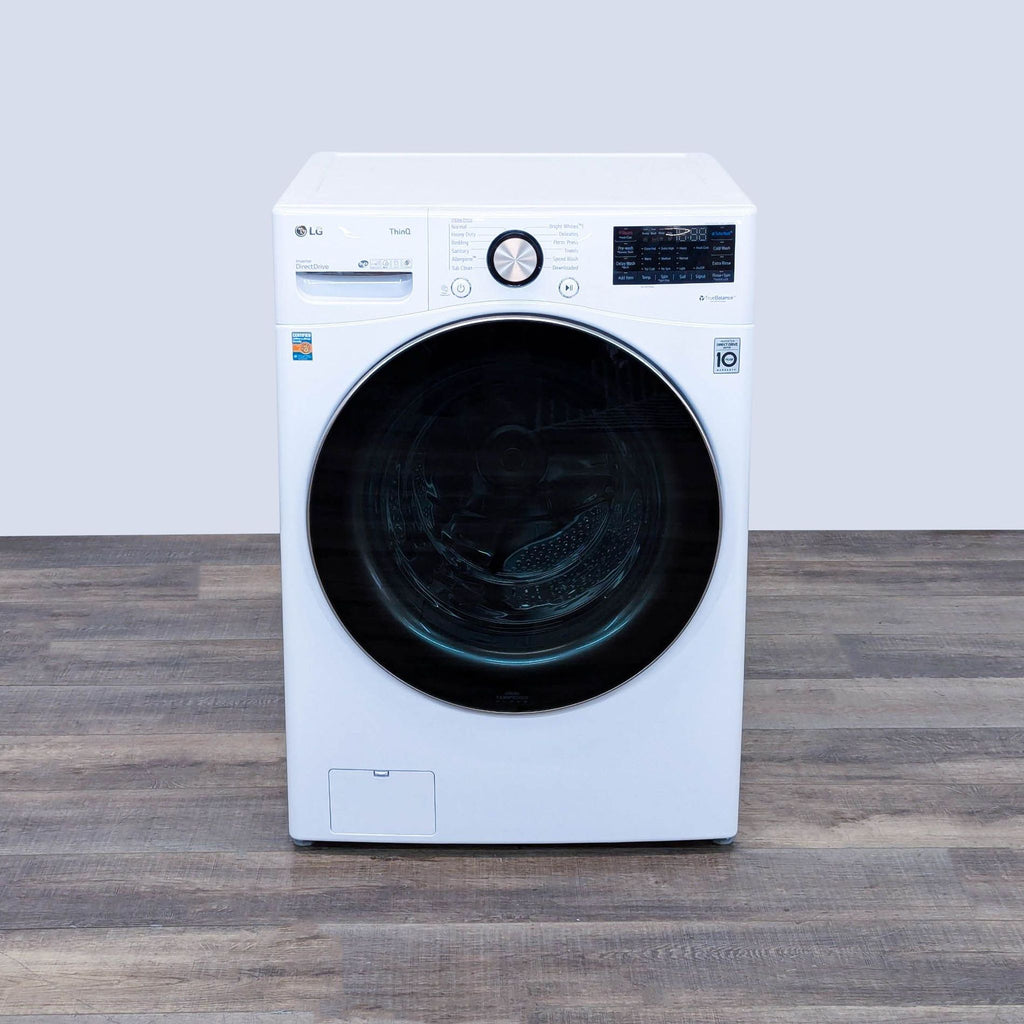 a washing machine on a wooden table.