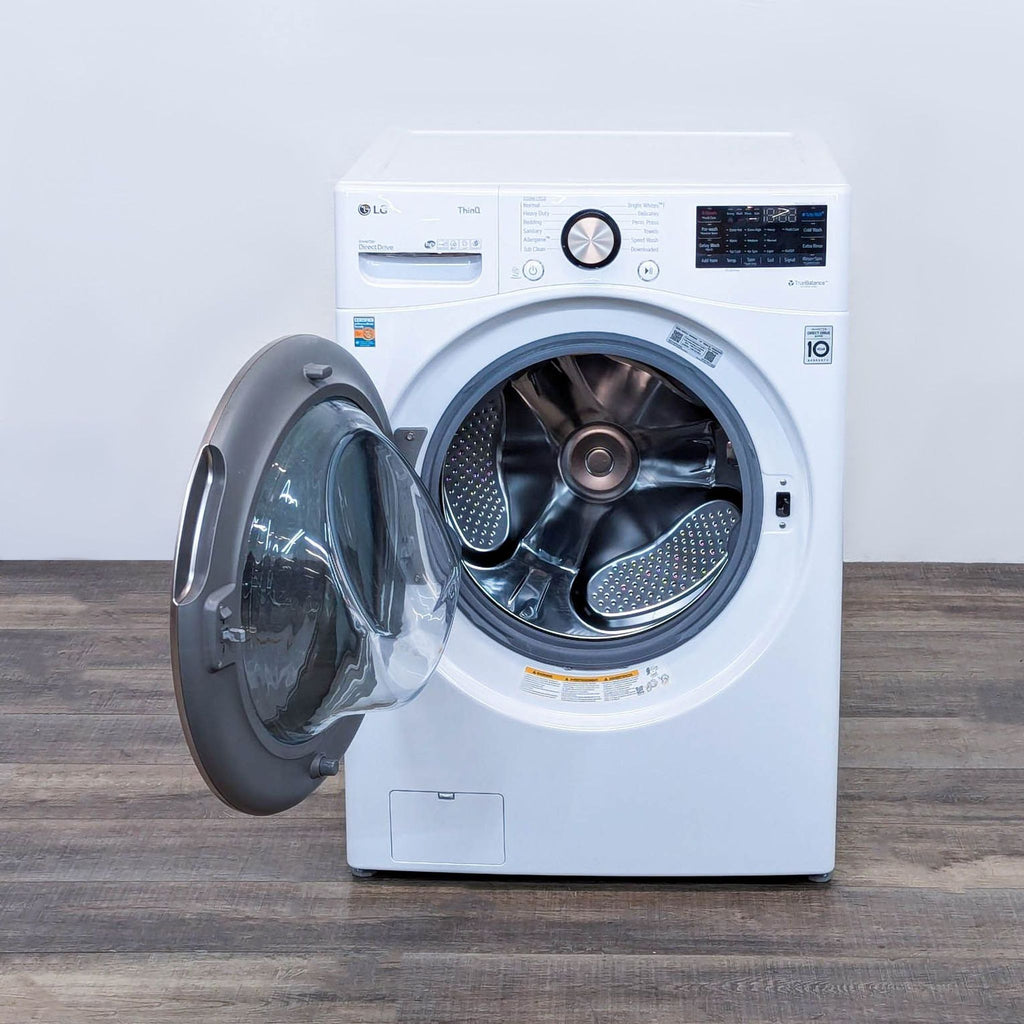 a washing machine with a fan on top of it.