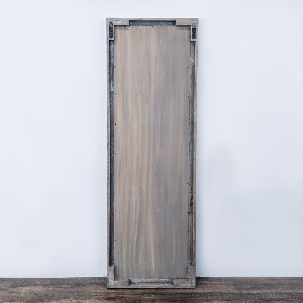 a wooden door with metal hinges.