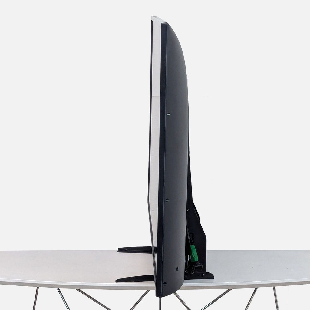 the back of the tv is a foldable table that can be folded up to a height of