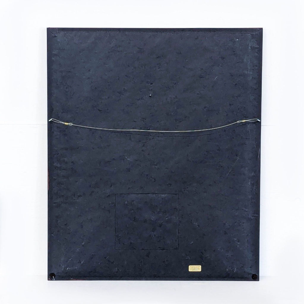 a black book with a gold chain