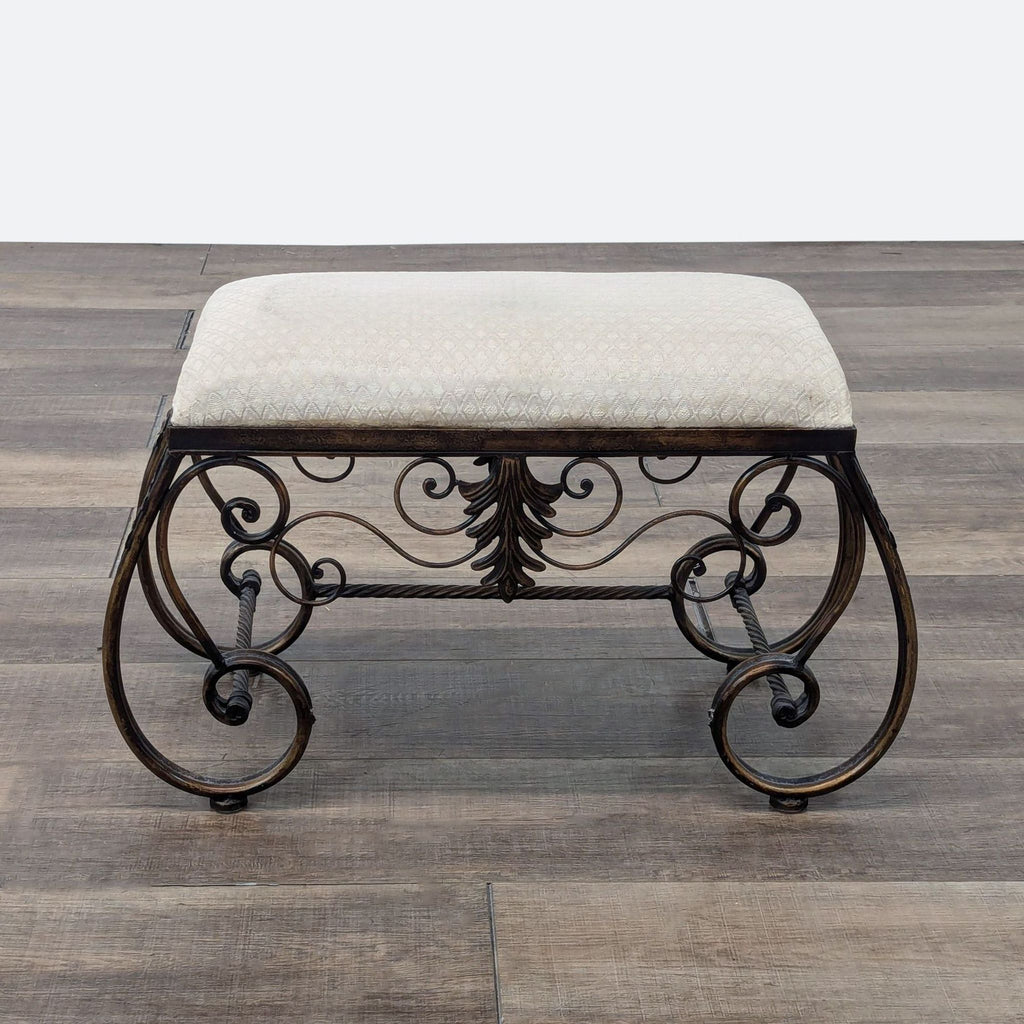 a pair of antique wrought iron bench seats.