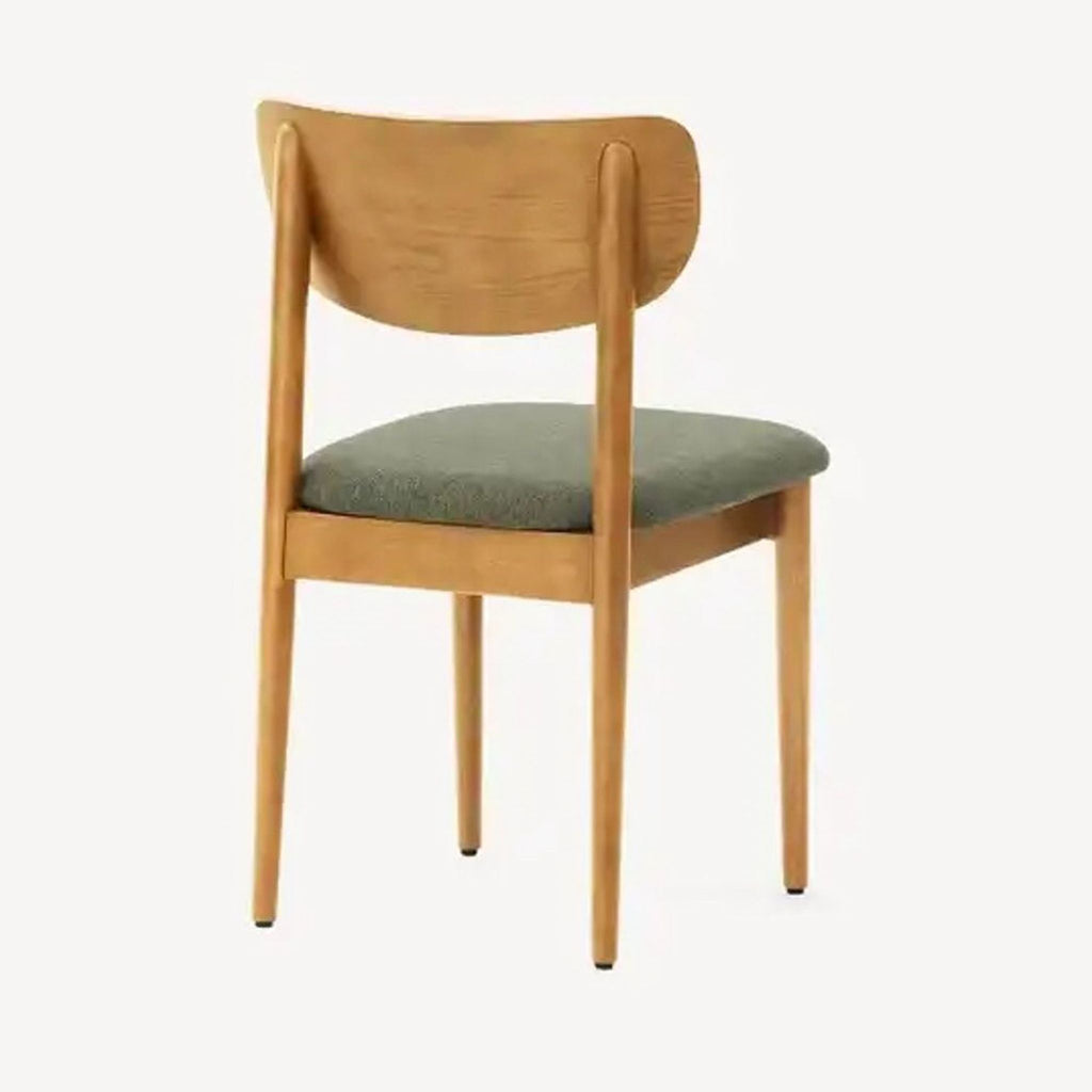 [ unused0 ] dining chair with a green seat.