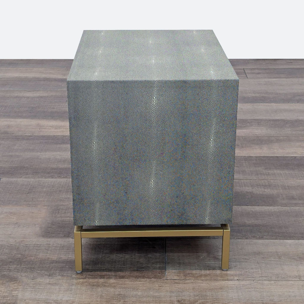 a side table with a glass top and a metal base.