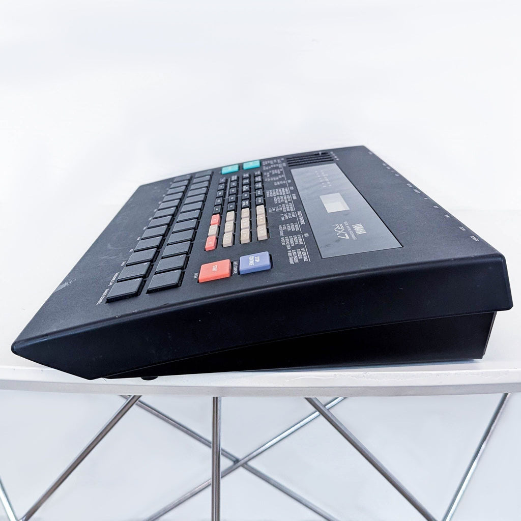 a black and red keyboard on a white table.