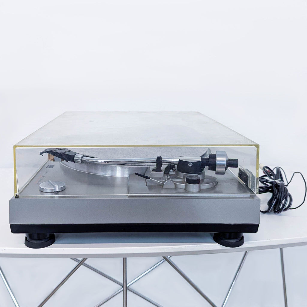 a record player with a glass cover.