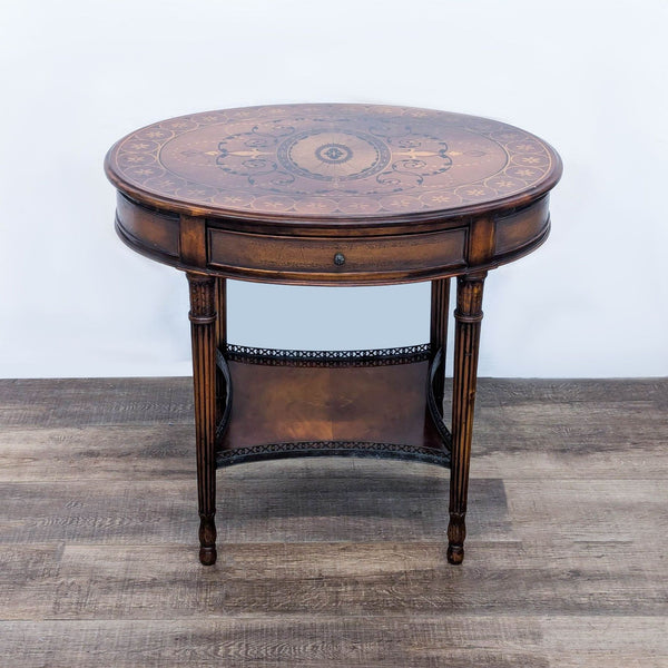 a round mahogany side table with a circular top.