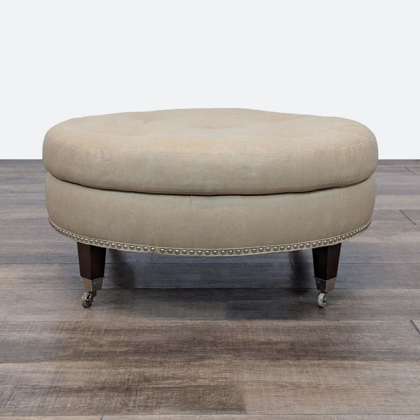 a french tufted ottoman with a brass footstool