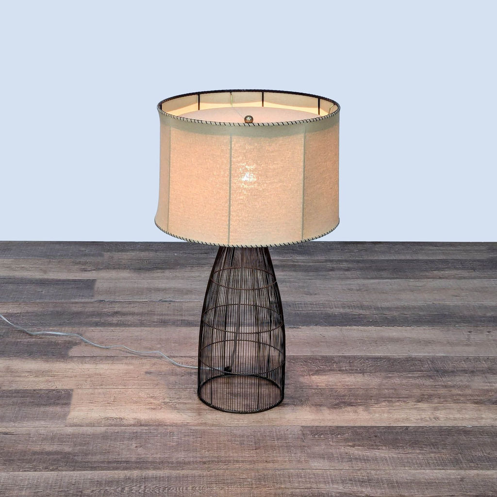 the lamp is made of wire and has a wire mesh shade.