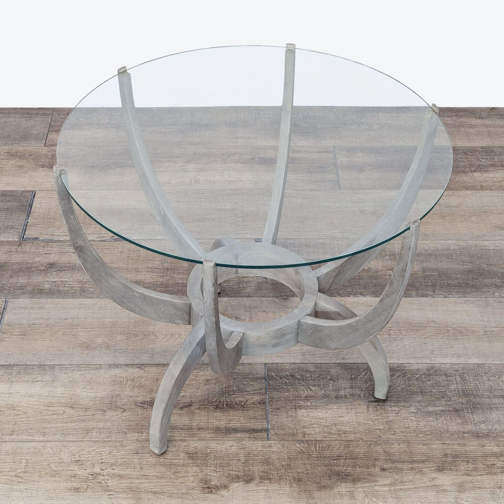 a round glass table with a glass top.