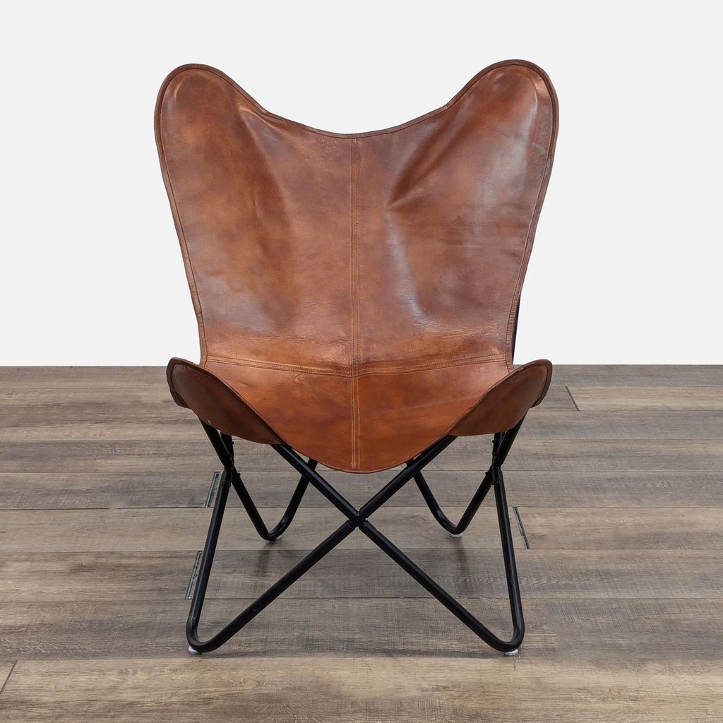 a pair of leather chairs