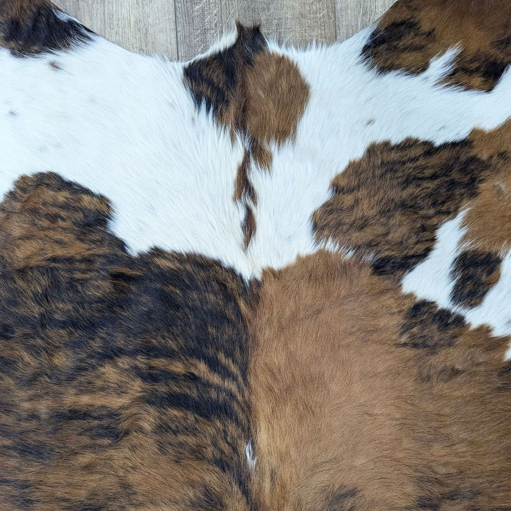 a large brown cow hide faux fur for sale