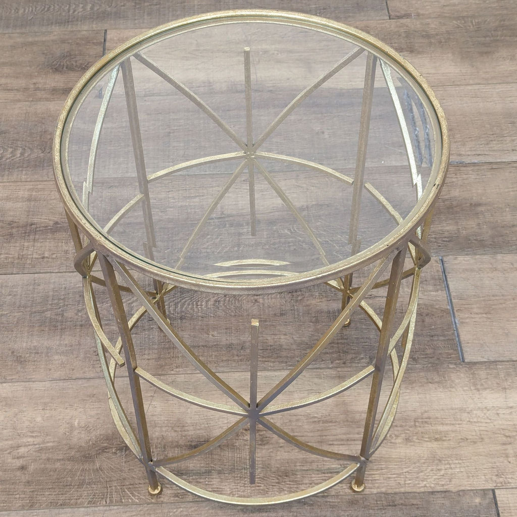 round metal coffee table with a glass top