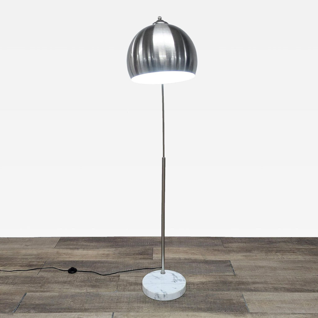 the lamp is made of steel and is made from a single piece of metal.