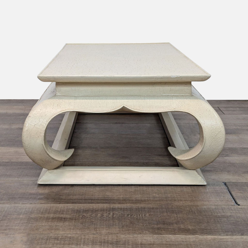 a coffee table with a curved top