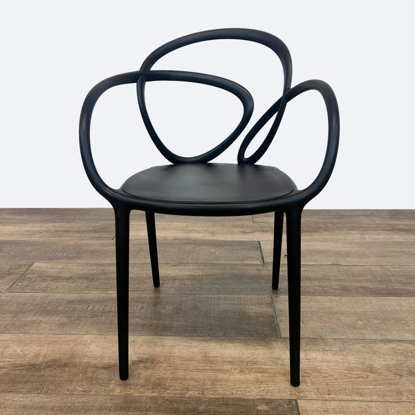 the chair is made of a black leather and is made of a thick black leather.