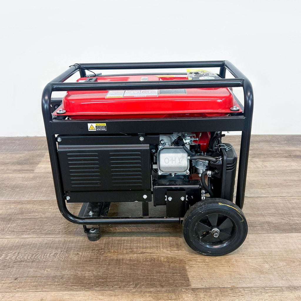 a red gas generator on a wooden floor.