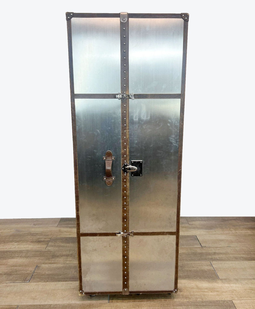 a vintage industrial style metal cabinet with a metal door and lock.