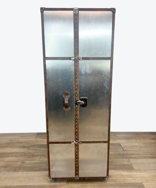 a vintage industrial style metal cabinet with a metal door and lock.