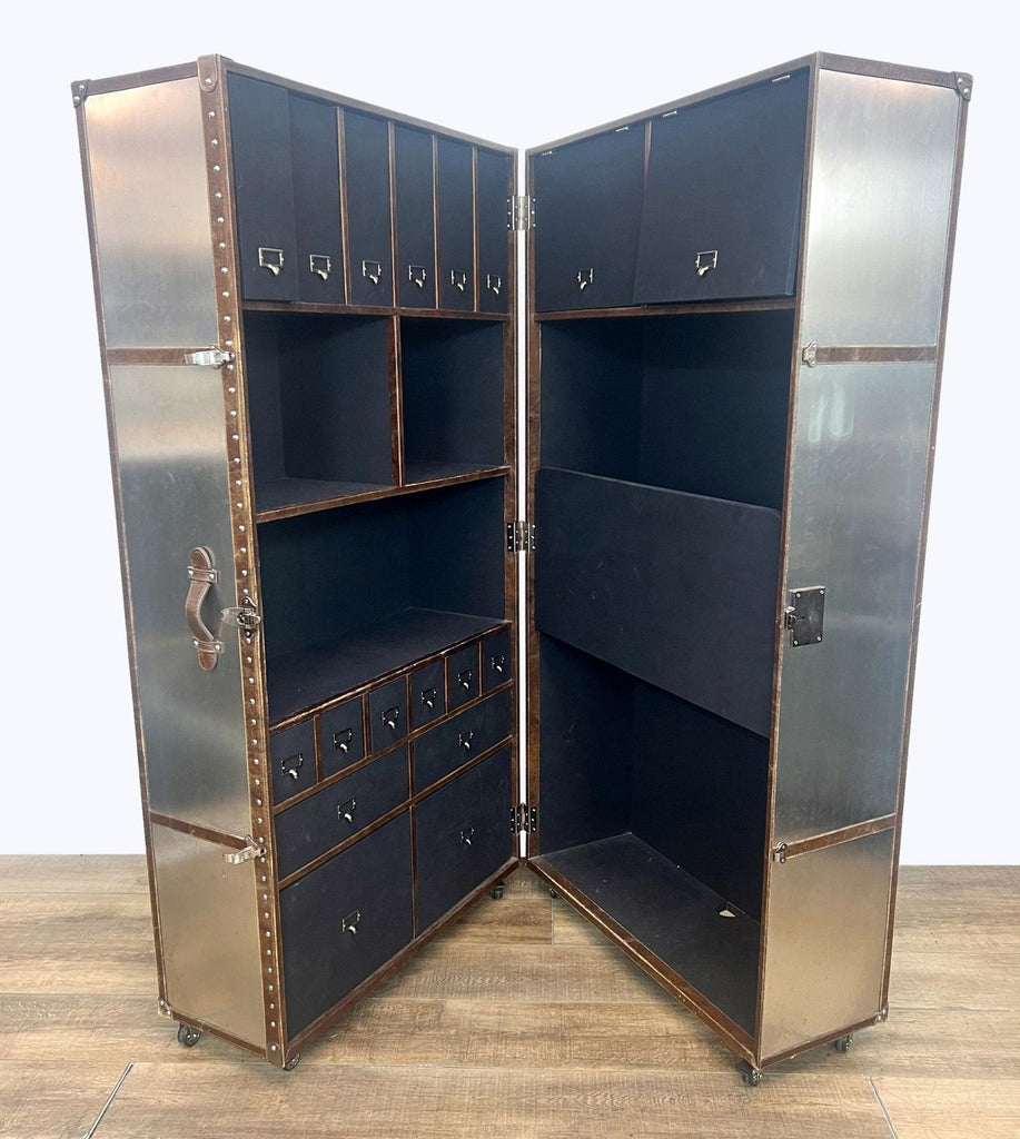 a vintage metal and glass cabinet with a metal interior.