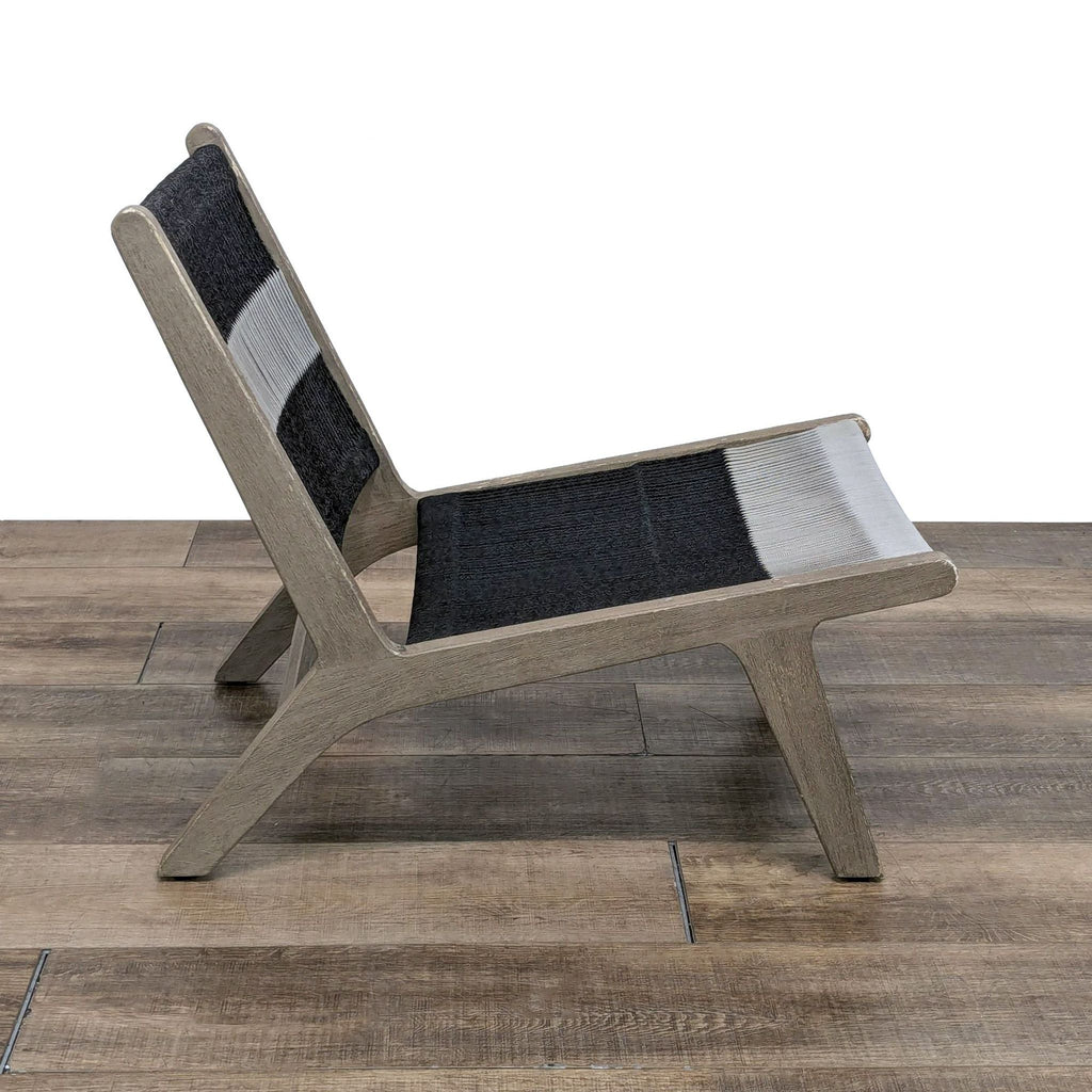 the [ unused0 ] chair is made of a solid wood and has a gray and black fabric