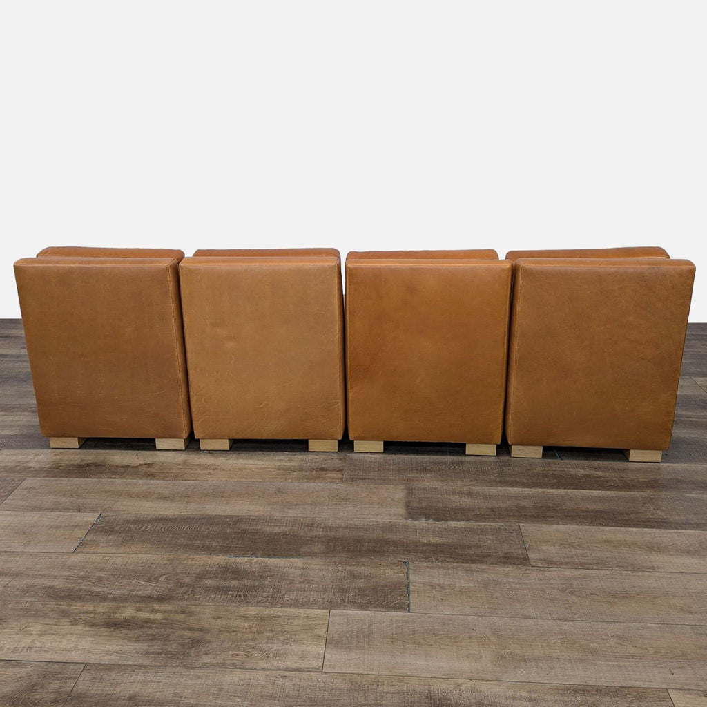 a set of four leather sofas by [ unused0 ], italy, circa 1970s