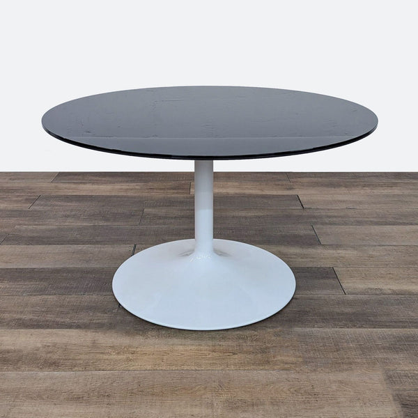 the [ unused0 ] round table with a black glass top