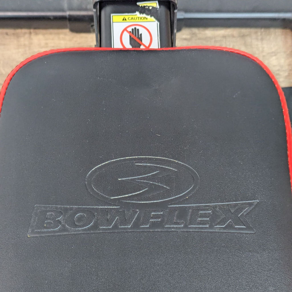 bow flex flexing machine with a no smoking sign