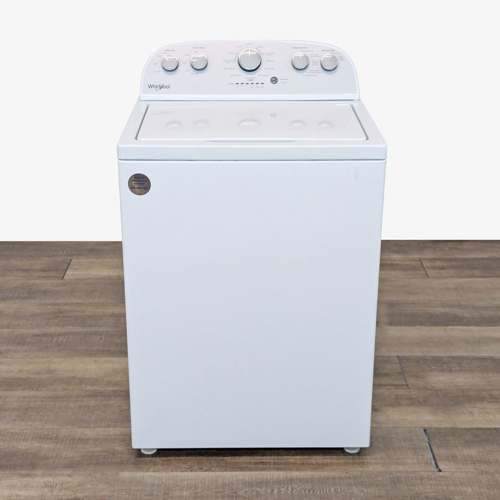 a white stove with a white front and back burner.