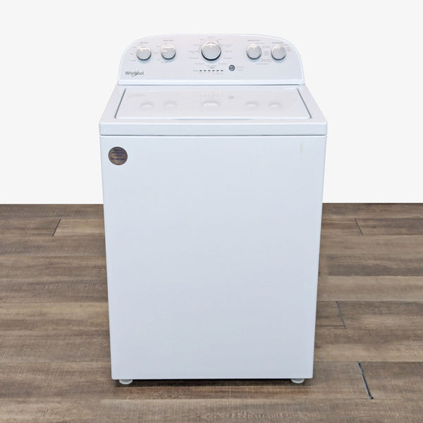 a white stove with a white front and back burner.