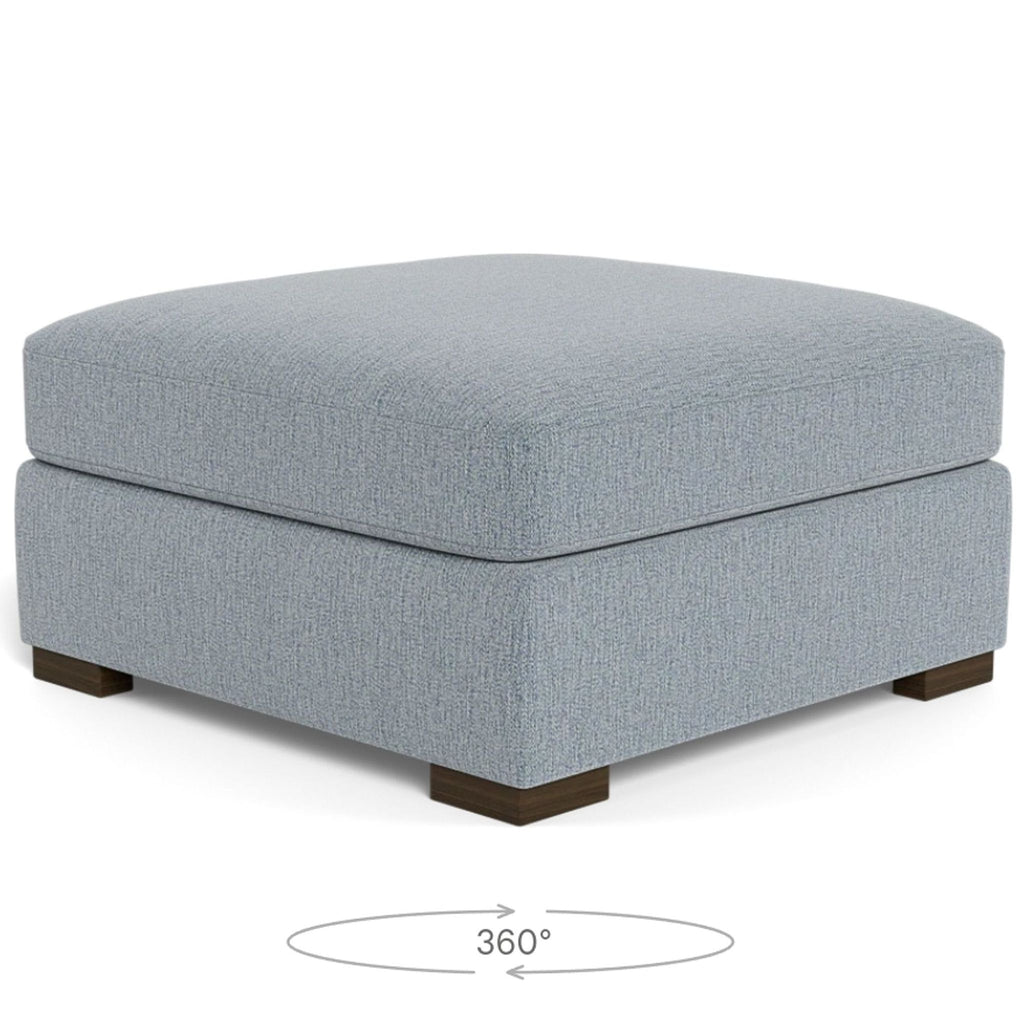 a grey linen ottoman with a dark brown ottoman.