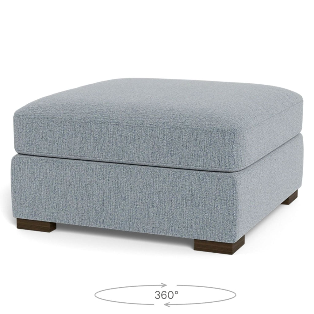 a grey linen ottoman with a square foot foot