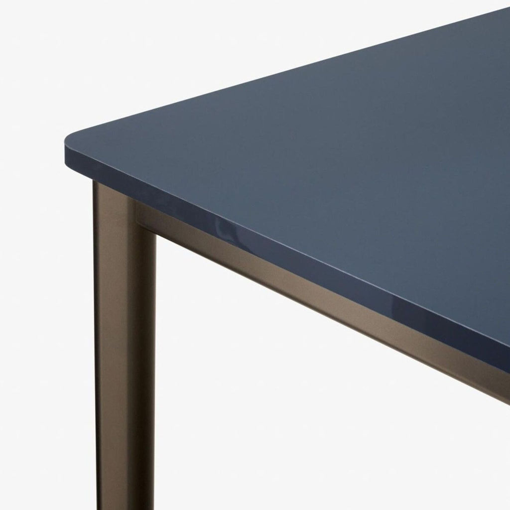 a close up of the top of a table with a dark blue top.