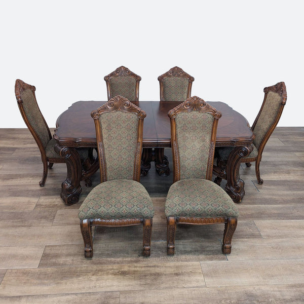 a set of six dining chairs and a table