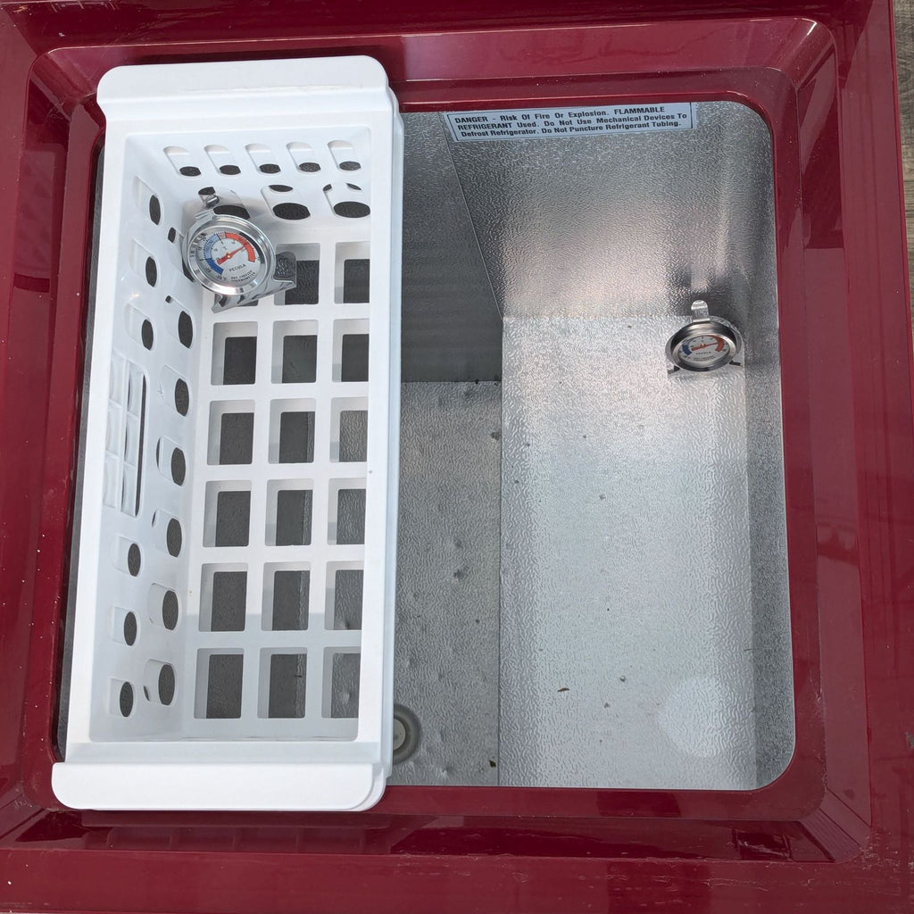 a sink with a toilet and a shower door 