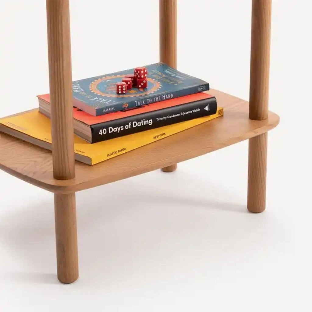 a small table with four books on it.