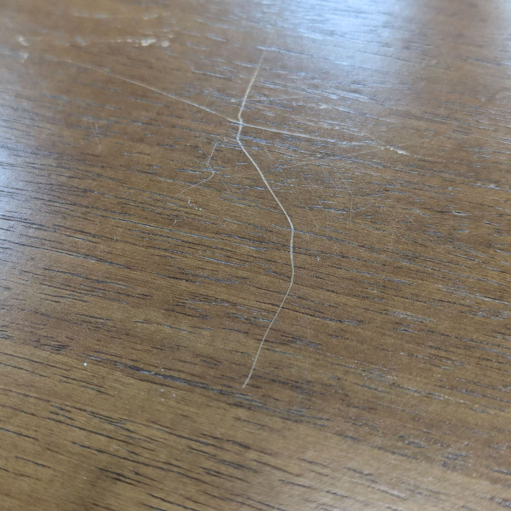 a white hair on a wooden table.