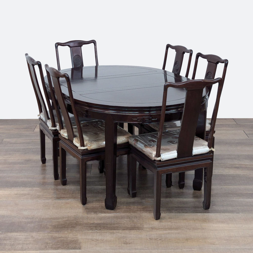 a round dining table with four chairs and a dining table.