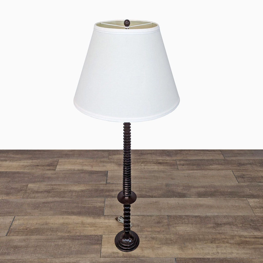 a vintage table lamp with a white shade.