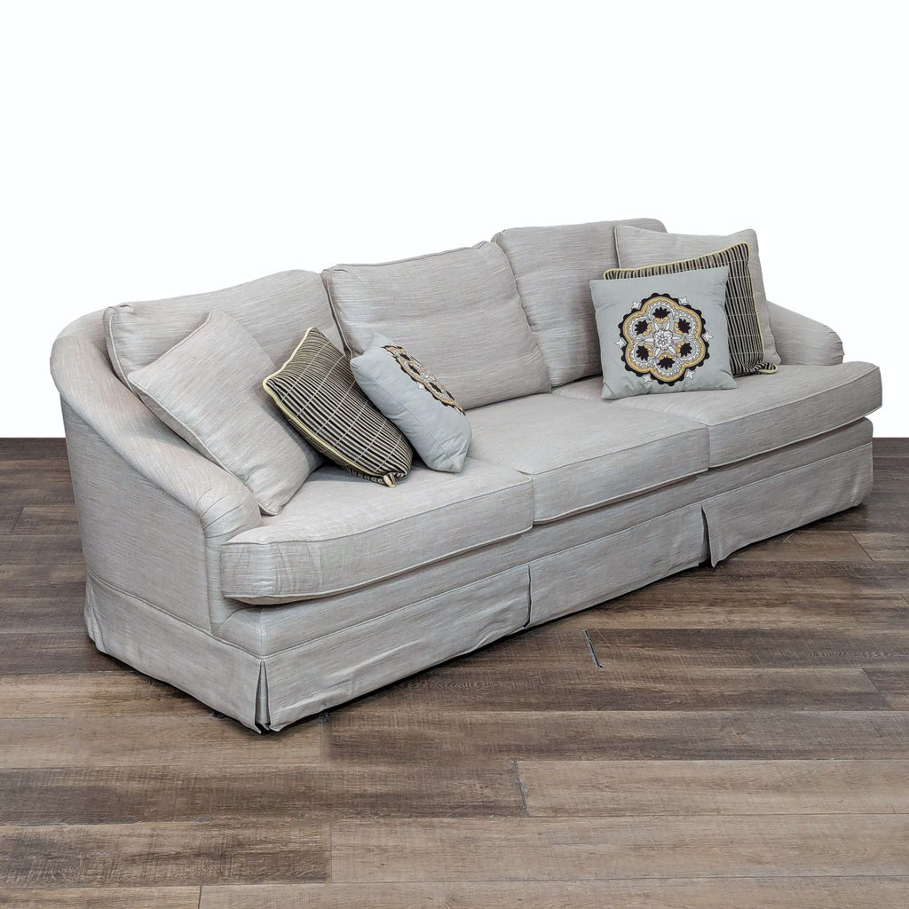 sofa is a modern and contemporary design that is made of soft grey fabric with a soft, comfortable