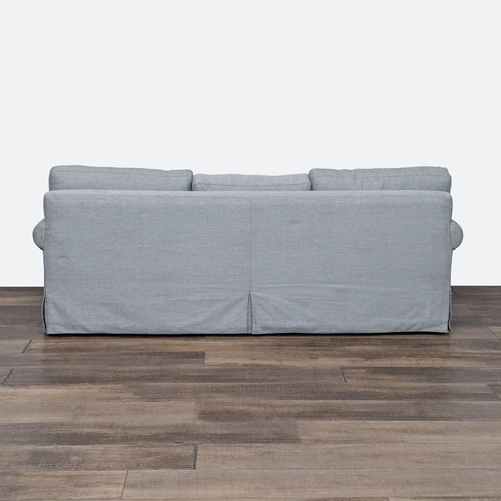 a modern sofa with a grey fabric