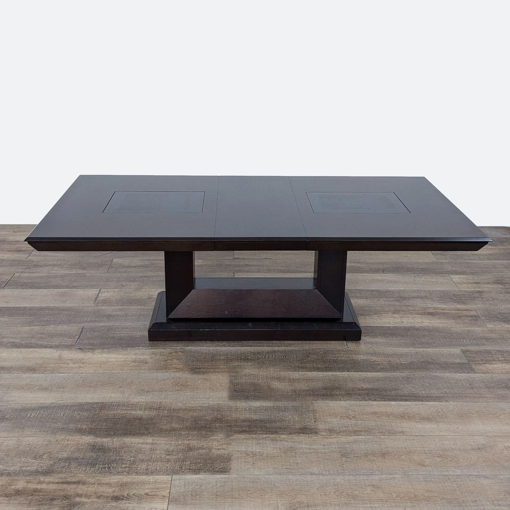 a [ unused0 ] coffee table with a square top.