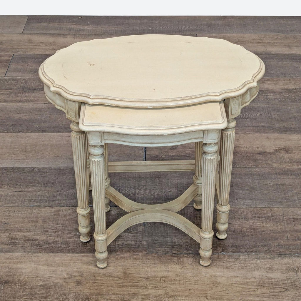 a french provincial style side table with a round top and a small round top.