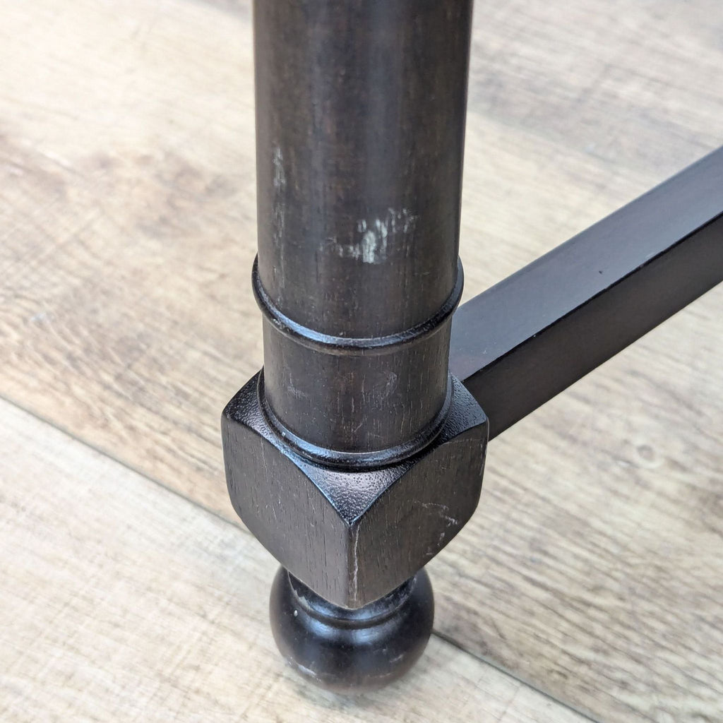 close up of the base of the iron bar table.