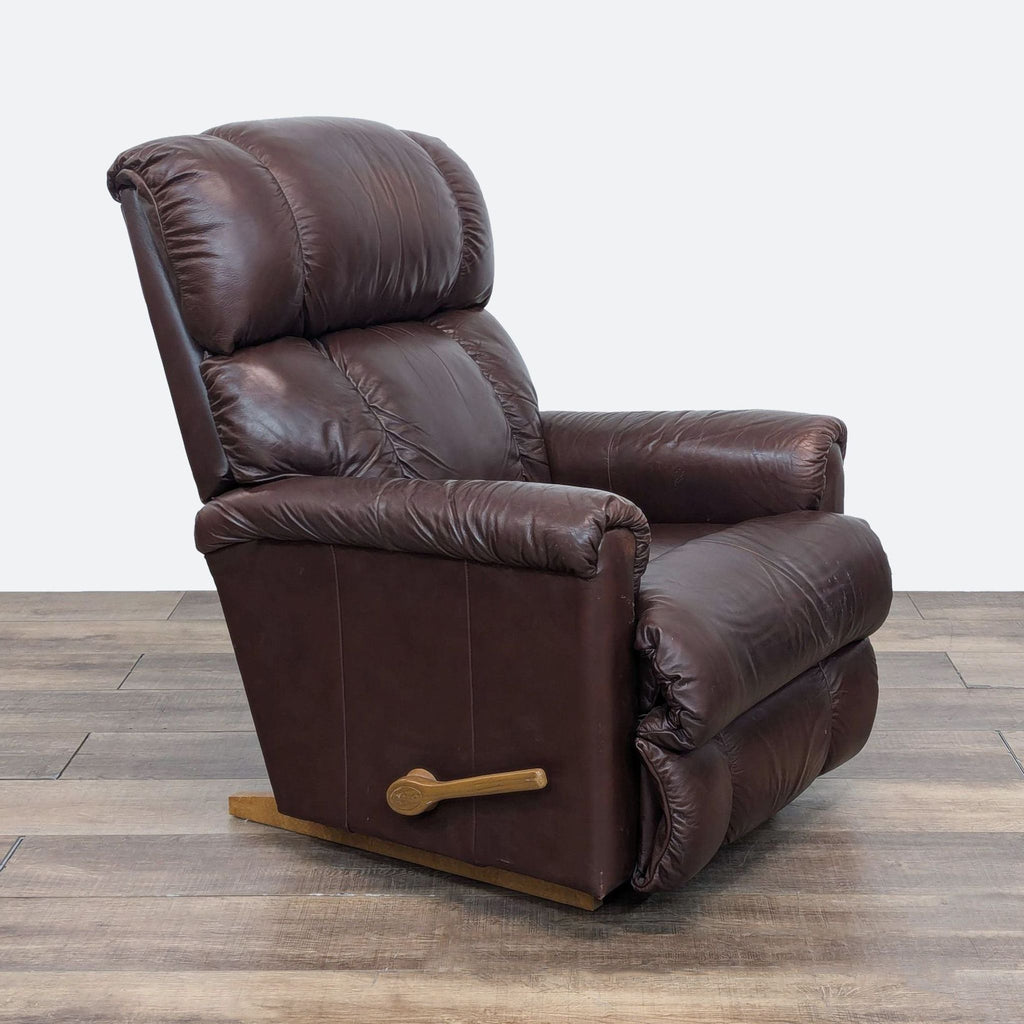 the [ unused0 ] recliner in brown leather with gold feet.